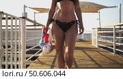 A woman with a mask for scuba diving is going to swim. Стоковое видео, видеограф Igor Skripachev / Фотобанк Лори