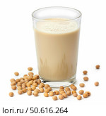 Glass of soy milk surrounded by soybeans on white background. Стоковое AI-изображение, AI-художник Иван Рябоконь / Фотобанк Лори