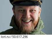 Bearded and cheerful man in a naval captain's cap. Стоковое фото, фотограф Дмитрий Киселёв / Фотобанк Лори