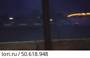 A couple of cars are speeding by with smoke in the corner. Russia. Moscow. 28.06.25. Стоковое видео, видеограф Ярославский Максим / Фотобанк Лори
