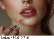 Cropped face of young woman holding a syringe with botox or hyaluronic acid near her lips, symbolizing modern aesthetic treatments aimed at enhancing facial beauty and youthful appearance. Стоковое AI-изображение, AI-художник Ирина Михайличенко / Фотобанк Лори