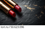 Top view two passion red lipsticks on black background. Beauty industry and fashion concept. Copy space. Advertisement for makeup artists. Стоковое AI-изображение, AI-художник Ирина Михайличенко / Фотобанк Лори