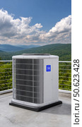 Heat pump providing cooling and heating on rooftop with mountain view. Стоковое AI-изображение, AI-художник Юрий Поздников / Фотобанк Лори