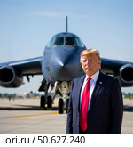 Американский президент Дональд Трамп на фоне стратегического бомбардировщика. Изображение, сгенерированное искусственным интеллектом (Ai-generated image) Стоковое AI-изображение, AI-художник Цибаев Алексей / Фотобанк Лори