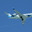 Самолет Bombardier Challenger 600 (CL-600-2B19 (CL-850)) (RA-67219) авиакомпании «Ямал» летит на фоне голубого неба в Сочи (2019 год). Редакционное фото, фотограф Екатерина Лызлова / Фотобанк Лори