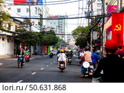 Morning Street in Ho Chi Minh City is Full of Motorbikes and Pedestrians (2024 год). Редакционное фото, фотограф Aleksandr Golubev / Фотобанк Лори