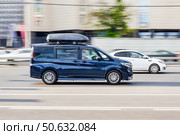 Blue van Honda Stepwgn Modulo X riding on the city streets. Редакционное фото, фотограф Константин Григорьев / Фотобанк Лори