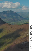 Rocky mountains and valley before sunset aerial. Стоковое видео, видеограф Михаил Коханчиков / Фотобанк Лори