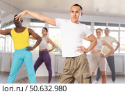 European guy with team of like-minded multinational people learn to elements of hip hop dance. Стоковое фото, фотограф Яков Филимонов / Фотобанк Лори