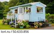 quaint trailer house ai generated. Стоковое AI-изображение, AI-художник Vectorwin / Фотобанк Лори