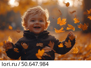 Little boy having fun during stroll in the forest at sunny autumn day. Child playing maple leaves. Baby tossing the leaves up. Active family time on nature. Hiking with little kids. Dry leaves rustle. Стоковое AI-изображение, AI-художник Ирина Михайличенко / Фотобанк Лори