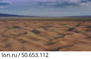 Aerial view of sand dunes in desert at sunset. Стоковое фото, фотограф Михаил Коханчиков / Фотобанк Лори