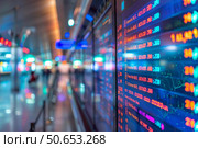 Stock market board showing numbers changing during trading session. Стоковое AI-изображение, AI-художник Иван Рябоконь / Фотобанк Лори
