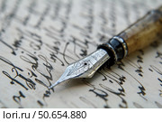 Elegant fountain pen lying on handwritten letter communicating nostalgia and history. Стоковое AI-изображение, AI-художник Иван Рябоконь / Фотобанк Лори