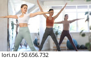 Girls standing perform complex greeting to moon Chandra namaskar. Стоковое видео, видеограф Яков Филимонов / Фотобанк Лори
