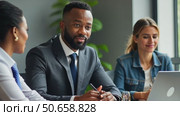 Confident african American male boss work cooperate with diverse team at office briefing, focused biracial businessman head meeting, collaborate discuss business ideas with colleagues. Стоковое AI-видео, аниматор Sergey Grishin / Фотобанк Лори