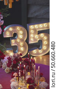 Glowing number 35 and festive decoration. Стоковое видео, видеограф Потийко Сергей / Фотобанк Лори
