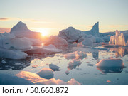 Icebergs floating in the arctic sea at sunset, disko bay, greenland. Стоковое AI-изображение, AI-художник Иван Рябоконь / Фотобанк Лори