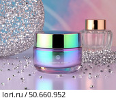 A bottle of makeup sits on a table next to a glass vase. Стоковое AI-изображение, AI-художник Ярославский Максим / Фотобанк Лори