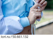 Young girl in sports blue hoodie outdoors. close-up of the hands. Стоковое фото, фотограф Роготнева Виктория / Фотобанк Лори