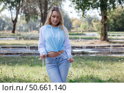 Young girl in sports blue hoodie outdoors. Стоковое фото, фотограф Роготнева Виктория / Фотобанк Лори