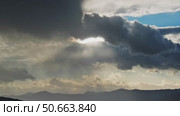 Moving sunbeams and mountain landscape. Стоковое видео, видеограф Михаил Коханчиков / Фотобанк Лори