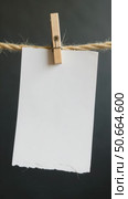 Blank Paper Clipped to a Rope, Minimalist Dark Background, Ideal for Stationery and Marketing Businesses. Стоковое AI-видео, аниматор Sergey Grishin / Фотобанк Лори