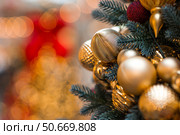 Beautiful Christmas background. Holiday toys on the Christmas tree. Concept of preparing decorations and furnishings for the New Year. New Year's card 2026. Стоковое фото, фотограф Photojuli / Фотобанк Лори