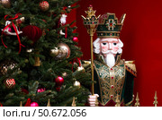 The Nutcracker on the New Year's tree in Moscow. New Year's card 2026. Beautiful Christmas background. Concept of preparing decorations and attire for the New Year. Стоковое фото, фотограф Photojuli / Фотобанк Лори
