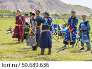 ELANTSY VILLAGE, IRKUTSK REGION, RUSSIA - July 5, 2025: Erdynskie Games are festival of nomadic peoples of Eurasia. Archers in national costumes compete in archery at sacred Erd Mountain on Baikal Lake. Редакционное фото, фотограф Виктория Катьянова / Фотобанк Лори
