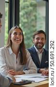 Smiling happy young woman talking male colleagues at shared workplace, worker laughing at funny joke, reading funny news, excited business success, employees having break, explore contract details. Стоковое AI-видео, аниматор Sergey Grishin / Фотобанк Лори