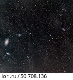 Galaxies surrounded by interstellar dust. Стоковое фото, фотограф Phillip Jones/Stocktrek Images / ТАСС / Фотобанк Лори