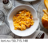 Huevos con chistorra - fried eggs with sausages served closeup. Стоковое фото, фотограф Яков Филимонов / Фотобанк Лори