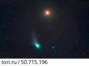 The infamous green Comet C/2022 E3 (ZTF) passing by reddish Mars in Taurus. Стоковое фото, фотограф Alan Dyer/Stocktrek Images / ТАСС / Фотобанк Лори