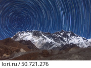 Circumpolar star trails above Lhotse mountain in Sagarmatha National Park, Nepal (2016 год). Стоковое фото, фотограф Jeff Dai/Stocktrek Images / ТАСС / Фотобанк Лори