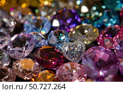 Colorful heart shaped diamond surrounded by sparkling gems. Стоковое AI-изображение, AI-художник Иван Рябоконь / Фотобанк Лори