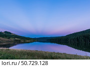 Earth's shadow and anti-crepuscular rays at Reesor Lake, Canada. Стоковое фото, фотограф Alan Dyer/Stocktrek Images / ТАСС / Фотобанк Лори
