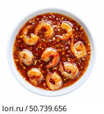Sweet chili shrimp in a white bowl, dipped in spicy sauce, garnished with red chili flakes. Стоковое AI-изображение, AI-художник Иван Рябоконь / Фотобанк Лори