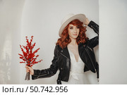 Bridal Rebellious Style, Beauty in Contrast Against a Minimal Background. Стоковое фото, фотограф Aleksandr Golubev / Фотобанк Лори