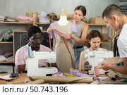 Focused attendees of dressmaking courses engaged in different activities. Стоковое фото, фотограф Яков Филимонов / Фотобанк Лори