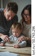 Parents Guide Their Child in an Engaging Art Activity at Home, Creating a Warm and Supportive Atmosphere. Стоковое AI-видео, аниматор Sergey Grishin / Фотобанк Лори