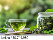 Freshly Brewed Green Tea in a Glass Cup With Tea Leaves on a Wooden Table. Стоковое AI-изображение, AI-художник Юлия Гапеенко / Фотобанк Лори