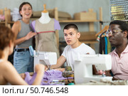 Participants in coterie practice sewing, chatting and talking, work with mannequin. Стоковое фото, фотограф Яков Филимонов / Фотобанк Лори