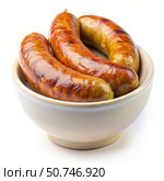 Three Browned Sausages in a White Bowl on a White Background. Generative AI. Стоковое AI-изображение, AI-художник Roman Zavorotny / Фотобанк Лори