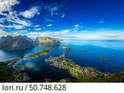 Amazing landscape of the Lofoten Islands from the top of Reinebringen Mountain with blue sky , county of Nordland, Norway. Стоковое фото, фотограф Андрей Армягов / Фотобанк Лори