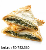 Delicious spanakopita triangles showing flaky phyllo dough and spinach filling. Стоковое AI-изображение, AI-художник Иван Рябоконь / Фотобанк Лори