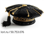 Black graduation cap with gold decorations representing academic achievement. Стоковое AI-изображение, AI-художник Иван Рябоконь / Фотобанк Лори