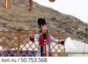 ELANTSY, IRKUTSK REGION, RUSSIA - July 5, 2025: Erdynskie Games– festival of nomadic peoples of Eurasia. Beautiful Buryat girl takes part in beauty contest on an open stage and performs a folk song. Редакционное фото, фотограф Виктория Катьянова / Фотобанк Лори