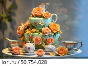 Delicious cake decorated with roses and flowers displayed with teacups and teapots. Стоковое AI-изображение, AI-художник Иван Рябоконь / Фотобанк Лори