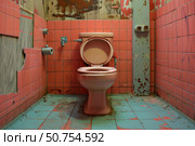 Old, dirty and damaged toilet in abandoned public restroom showing decay and neglect. Стоковое AI-изображение, AI-художник Иван Рябоконь / Фотобанк Лори